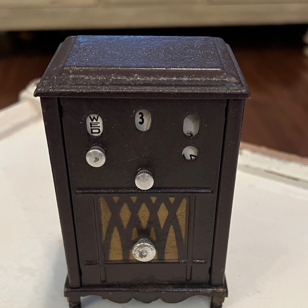Art Deco mechanical cigarette dispenser with a desk calendar-looks like radio